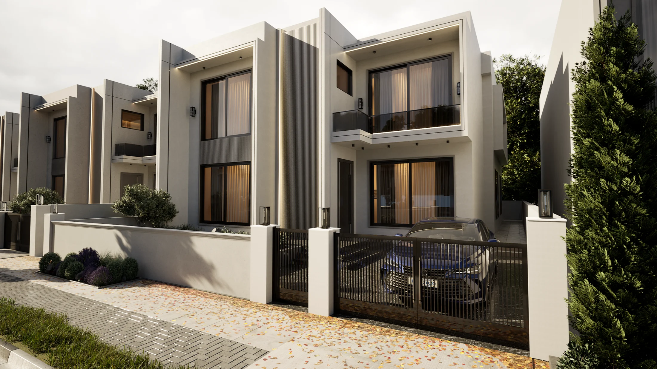 Warm stone façades, glass balconies, and private front gardens at Zakho Hills